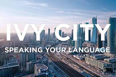 Ivy City: Ihre Sprache, unsere Lösung Stadtlandschaft mit Hochhäusern und dem Logo 'IVY CITY'.